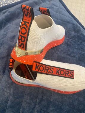 Michael Kors White and Orange KORS Slip on  Sneakers